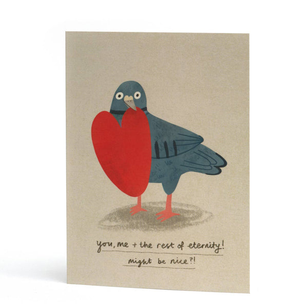 Funny love card featuring an illustration of a blue pigeon holding a large red heart, with handwritten text at the bottom that reads, 'you, me + the rest of eternity! might be nice?!'.