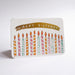 A rectangular birthday card with rounded corners, featuring a gold banner that reads 'HAPPY BIRTHDAY' above a row of colorful striped candles, photographed on a white background.