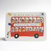 An A6 greeting card, tent fold, landscape, featuring a hand-drawn red double-decker bus with illustrated passengers and balloons, with the text 'SO MUCH LOVE ON YOUR wedding day!' across the front, photographed on a white background.