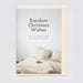 A funny/surreal Christmas card, shown in flat lay, sitting atop a cream envelope.