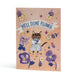 An A6 congratulations card featuring a whimsical illustration of a tabby cat in a blue-and-white dress surrounded by purple flowers and small stars, with a banner reading 'WELL DONE FLOWER' on a peach background.