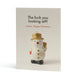 An A6, sweary, quirky Christmas card with a small snowman ornament on the front. The card has a light cream background and the snowman is saying, "The fuck you looking at?! I mean, Happy Christmas."
